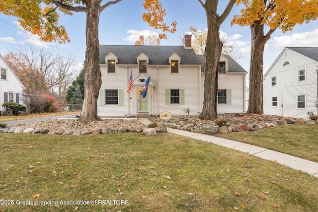 350 N Marshall Ave, Marshall, MI 49068 - view of front of house featuring a chimney and a front yard