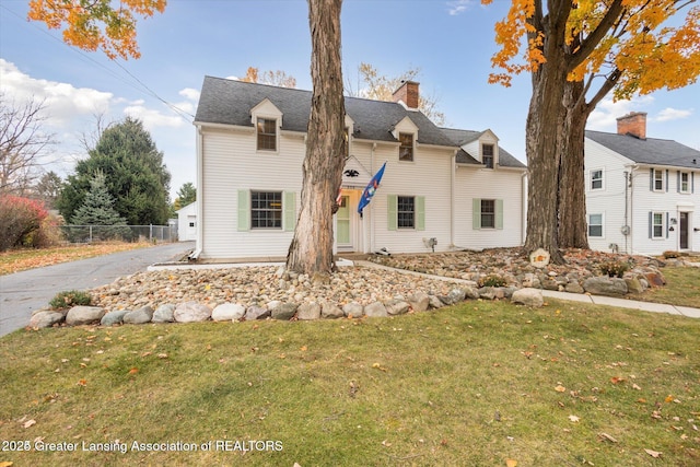 350 N Marshall Ave, Marshall, MI 49068 - view of front of house with a chimney and asphalt driveway