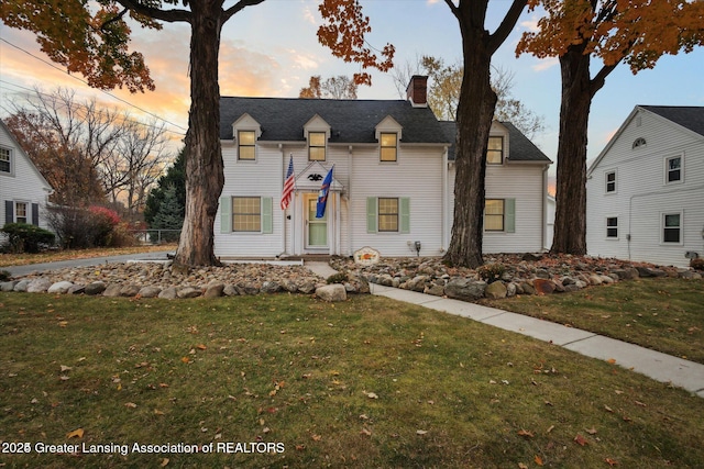 350 N Marshall Ave, Marshall, MI 49068 - view of front of home featuring a chimney and a front lawn