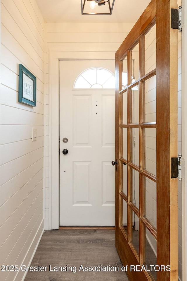720 N Fairview Ave, Lansing, MI 48912 - doorway to outside featuring wood finished floors