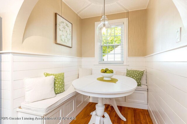 720 N Fairview Ave, Lansing, MI 48912 - dining area featuring breakfast area, wood finished floors, and wainscoting