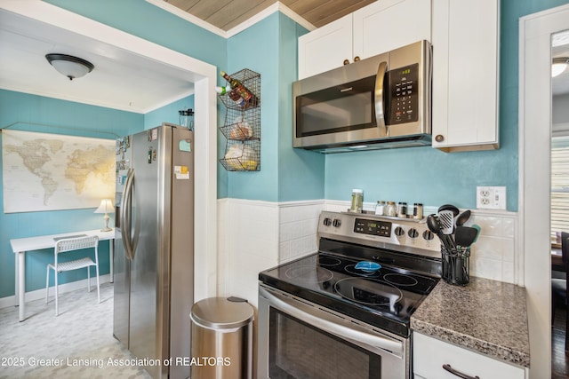 515 N Fairview Ave, Lansing, MI 48912 - kitchen featuring appliances with stainless steel finishes, crown molding, white cabinetry, and wainscoting