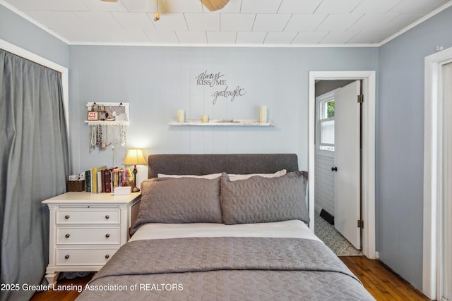 515 N Fairview Ave, Lansing, MI 48912 - bedroom with ornamental molding and wood finished floors