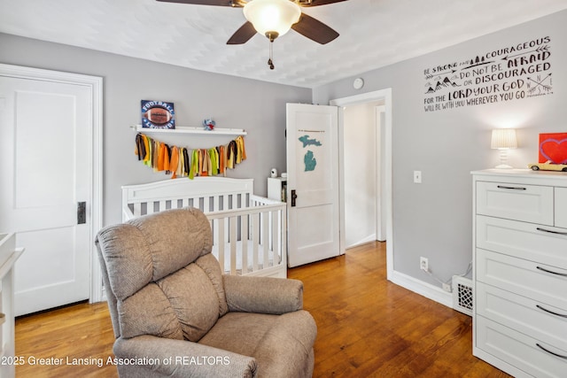 515 N Fairview Ave, Lansing, MI 48912 - bedroom featuring wood finished floors and a ceiling fan