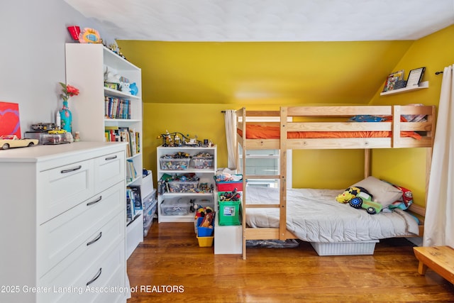 515 N Fairview Ave, Lansing, MI 48912 - bedroom with wood finished floors and lofted ceiling