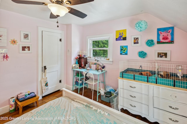 515 N Fairview Ave, Lansing, MI 48912 - bedroom with wood finished floors, ceiling fan, and vaulted ceiling