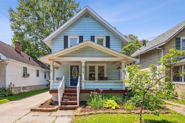 515 N Fairview Ave, Lansing, MI 48912 - american foursquare style home featuring a porch