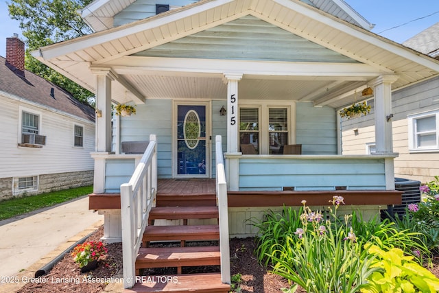 515 N Fairview Ave, Lansing, MI 48912 - view of front facade featuring a porch and cooling unit