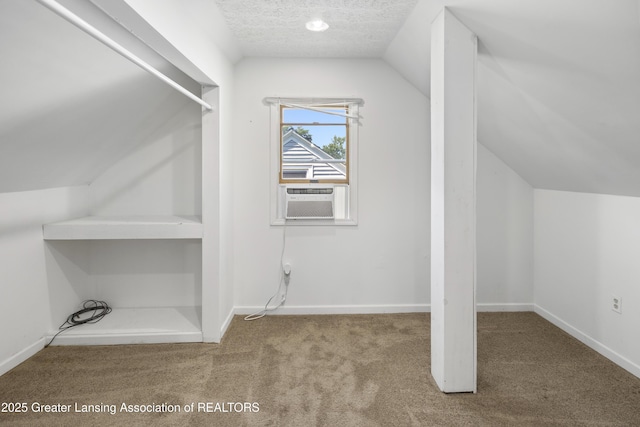 2335 Harding Ave, Lansing, MI 48910 - bonus room with vaulted ceiling, carpet flooring, cooling unit, and a textured ceiling