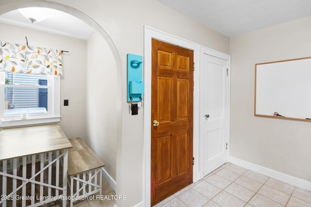 2335 Harding Ave, Lansing, MI 48910 - foyer entrance with arched walkways and light tile patterned flooring