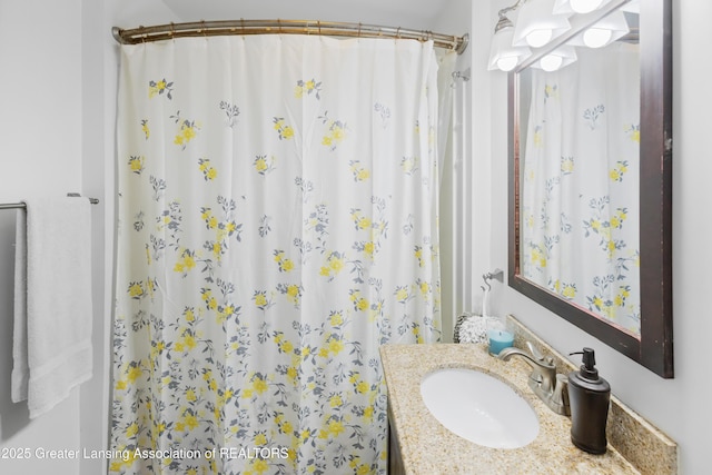2335 Harding Ave, Lansing, MI 48910 - bathroom featuring vanity and curtained shower