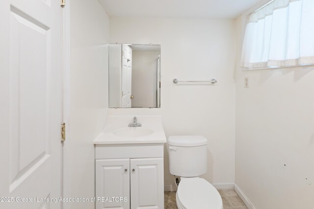 2335 Harding Ave, Lansing, MI 48910 - bathroom featuring toilet and vanity