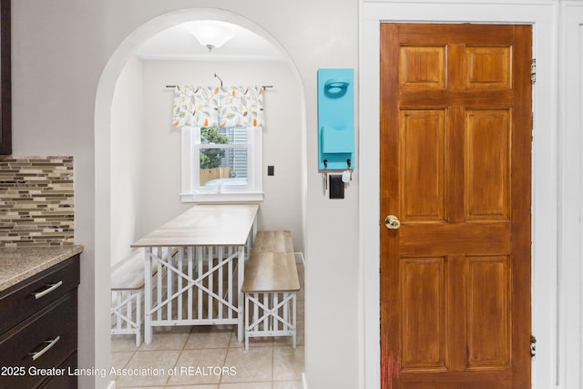 2335 Harding Ave, Lansing, MI 48910 - foyer with light tile patterned floors and arched walkways