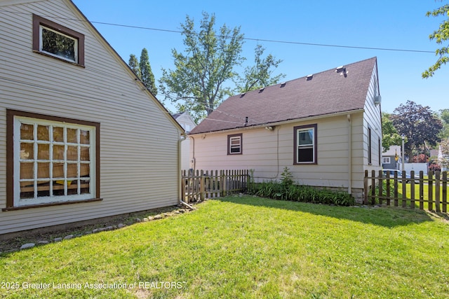 2335 Harding Ave, Lansing, MI 48910 - rear view of property with roof with shingles