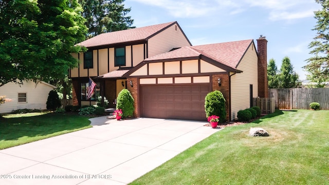 5939 Highgate Ave, East Lansing, MI 48823 - tudor house with a shingled roof, an attached garage, brick siding, and concrete driveway