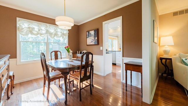5939 Highgate Ave, East Lansing, MI 48823 - dining room featuring ornamental molding and hardwood / wood-style floors