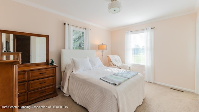 5939 Highgate Ave, East Lansing, MI 48823 - bedroom with multiple windows, light colored carpet, and crown molding