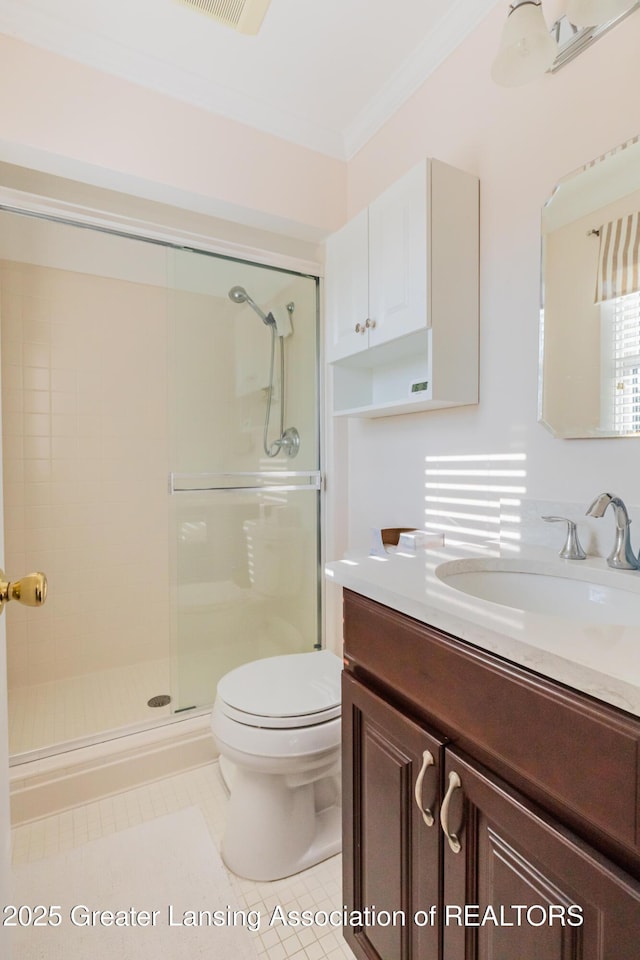 5939 Highgate Ave, East Lansing, MI 48823 - full bathroom featuring vanity, a shower stall, ornamental molding, and tile patterned flooring