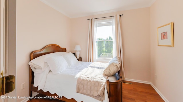 5939 Highgate Ave, East Lansing, MI 48823 - bedroom with wood finished floors and baseboards