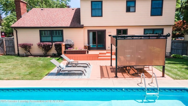 5939 Highgate Ave, East Lansing, MI 48823 - rear view of house with a chimney and a patio