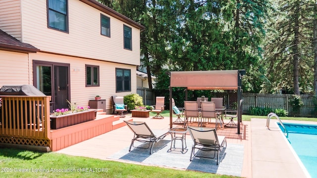 5939 Highgate Ave, East Lansing, MI 48823 - wooden terrace featuring outdoor dining area, a grill, and a patio area
