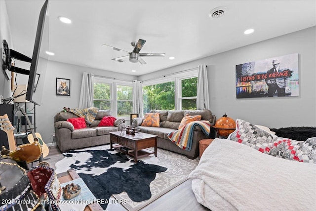 3707 W Michigan Ave, Lansing, MI 48917 - living room with wood finished floors, ceiling fan, and recessed lighting