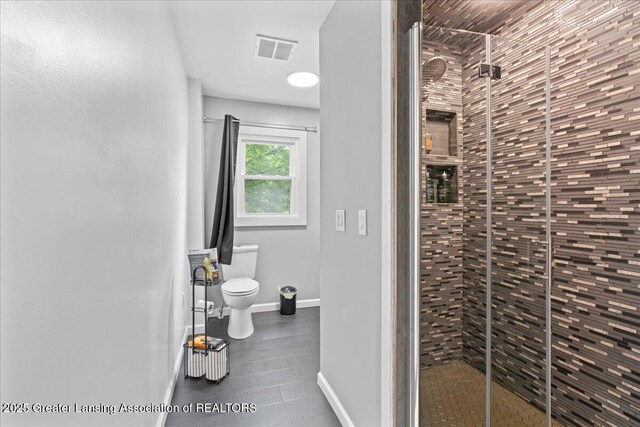 3707 W Michigan Ave, Lansing, MI 48917 - full bathroom with toilet and a stall shower