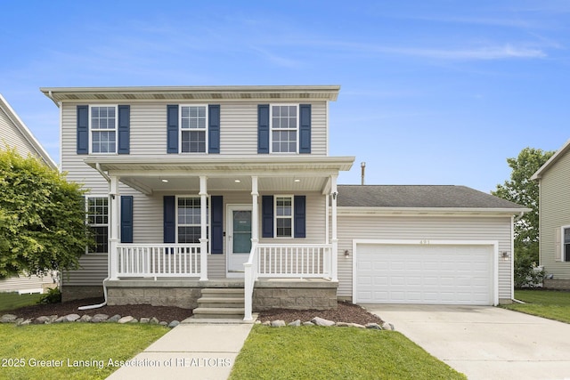 491 Anhinga Dr, East Lansing, MI 48823 - view of front of home featuring concrete driveway, covered porch, an attached garage, and a front lawn