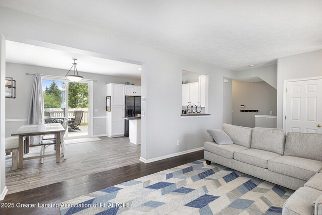 491 Anhinga Dr, East Lansing, MI 48823 - living area with wood finished floors and baseboards