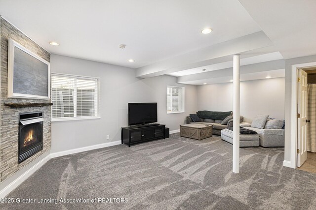 491 Anhinga Dr, East Lansing, MI 48823 - living area featuring carpet flooring, a glass covered fireplace, and recessed lighting