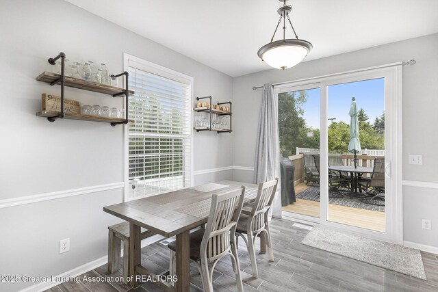 491 Anhinga Dr, East Lansing, MI 48823 - dining room with healthy amount of natural light and wood finished floors