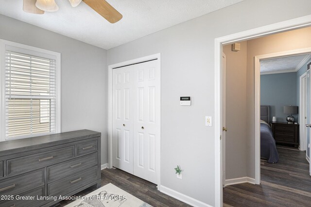 491 Anhinga Dr, East Lansing, MI 48823 - bedroom featuring dark wood finished floors, a closet, and ceiling fan