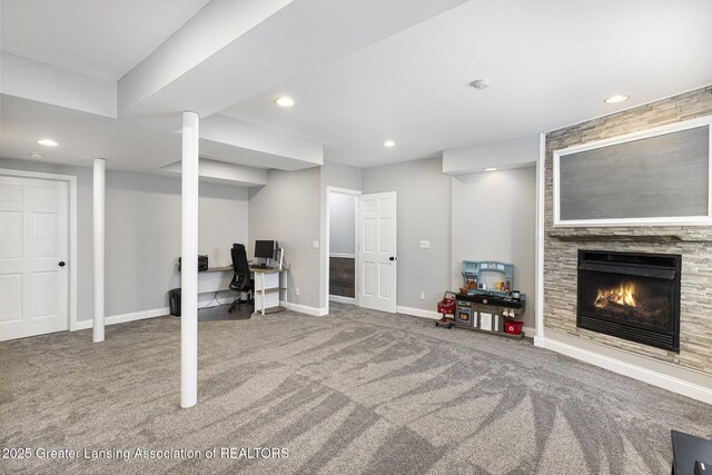 491 Anhinga Dr, East Lansing, MI 48823 - finished below grade area with carpet, a tiled fireplace, a desk, and recessed lighting
