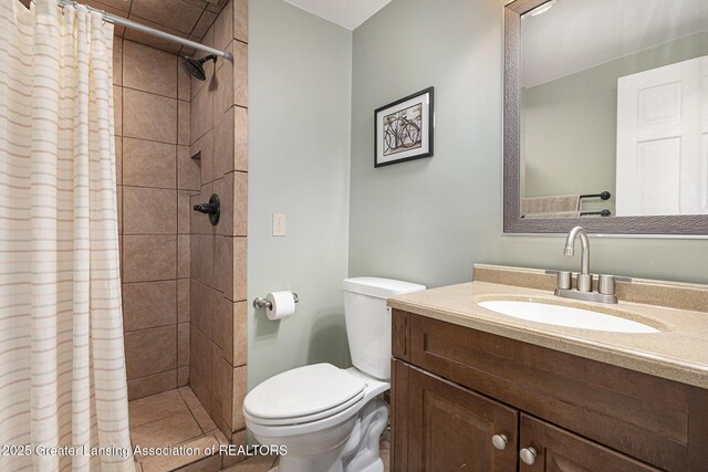 491 Anhinga Dr, East Lansing, MI 48823 - bathroom with vanity and a tile shower