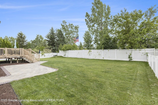 491 Anhinga Dr, East Lansing, MI 48823 - fenced backyard featuring a patio, a wooden deck, and stairs