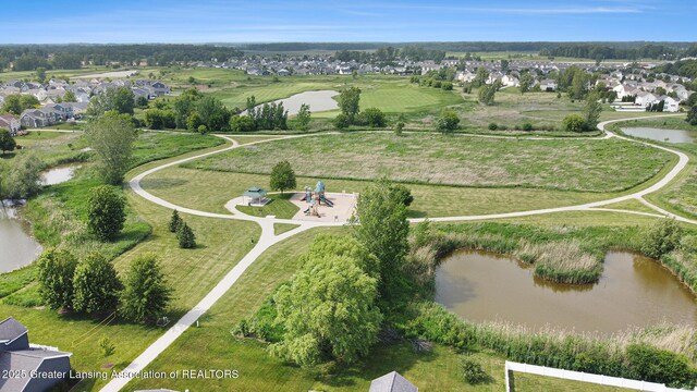 491 Anhinga Dr, East Lansing, MI 48823 - aerial overview of property's location with a large body of water and nearby suburban area