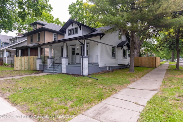 1041 Parker St, Lansing, MI 48912 - view of front facade featuring covered porch and roof with shingles