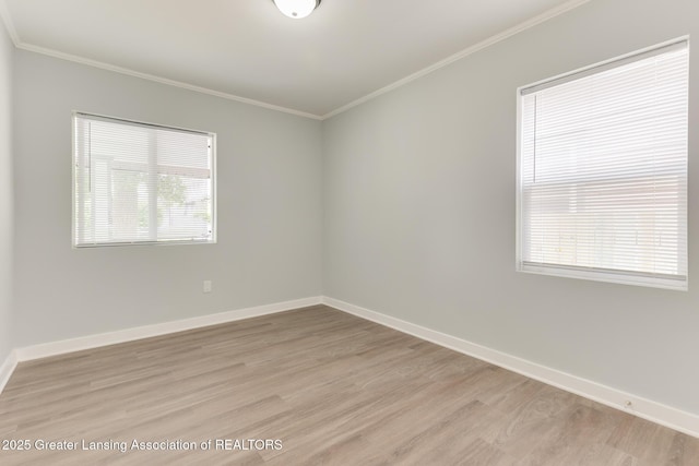 1041 Parker St, Lansing, MI 48912 - unfurnished room featuring ornamental molding and light wood-style floors