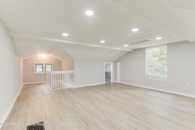 1041 Parker St, Lansing, MI 48912 - additional living space with vaulted ceiling, light wood-style floors, recessed lighting, and attic access
