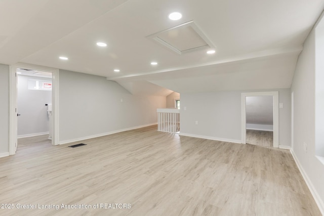 1041 Parker St, Lansing, MI 48912 - unfurnished room with light wood-type flooring, recessed lighting, and lofted ceiling