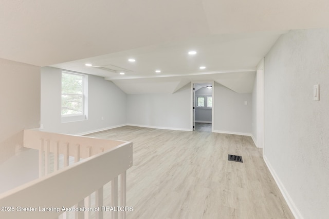 1041 Parker St, Lansing, MI 48912 - bonus room with light wood-type flooring, vaulted ceiling, and recessed lighting