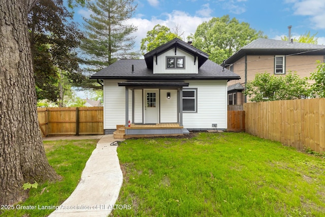 1041 Parker St, Lansing, MI 48912 - view of front of house with a fenced backyard and roof with shingles