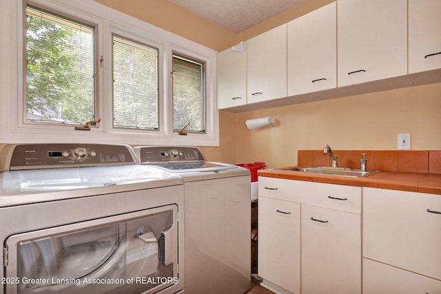 1603 Roseland Ave, East Lansing, MI 48823 - laundry area with separate washer and dryer and cabinet space