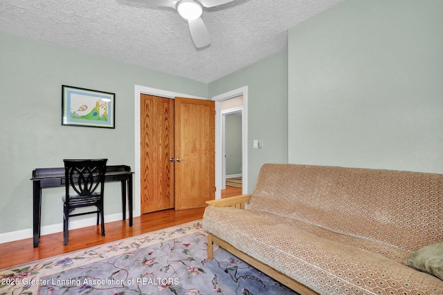 1603 Roseland Ave, East Lansing, MI 48823 - sitting room featuring wood finished floors, ceiling fan, and a textured ceiling