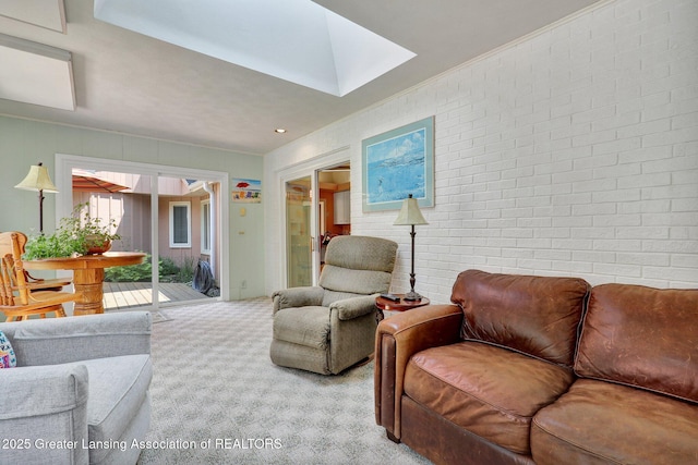 1603 Roseland Ave, East Lansing, MI 48823 - living room featuring carpet flooring, a skylight, brick wall, and ornamental molding