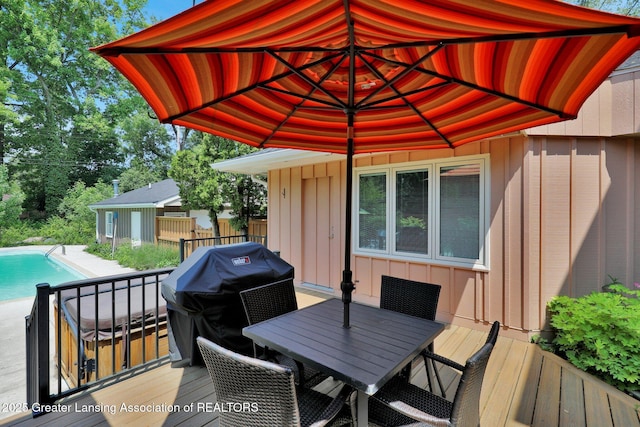 1603 Roseland Ave, East Lansing, MI 48823 - wooden deck with area for grilling and outdoor dining space