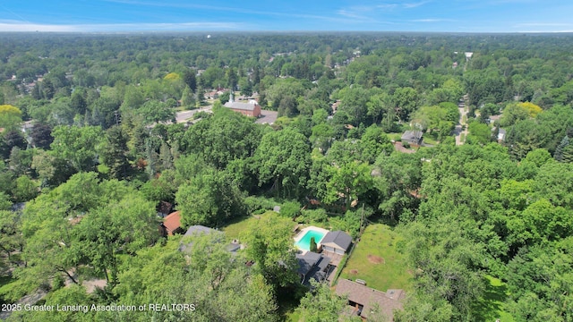 1603 Roseland Ave, East Lansing, MI 48823 - aerial view of property and surrounding area with a heavily wooded area and a pool