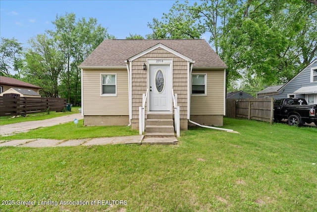 2914 W Holmes Rd, Lansing, MI 48911 - bungalow with roof with shingles and entry steps