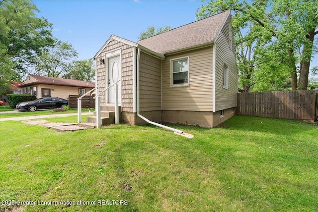 2914 W Holmes Rd, Lansing, MI 48911 - view of front of home featuring entry steps and roof with shingles