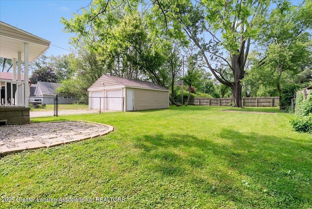 2914 W Holmes Rd, Lansing, MI 48911 - view of yard with a detached garage and an outbuilding